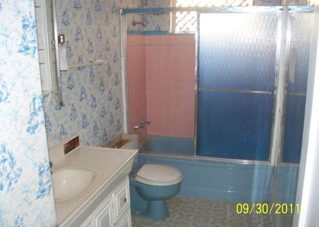 Ugly wallpapered bathroom