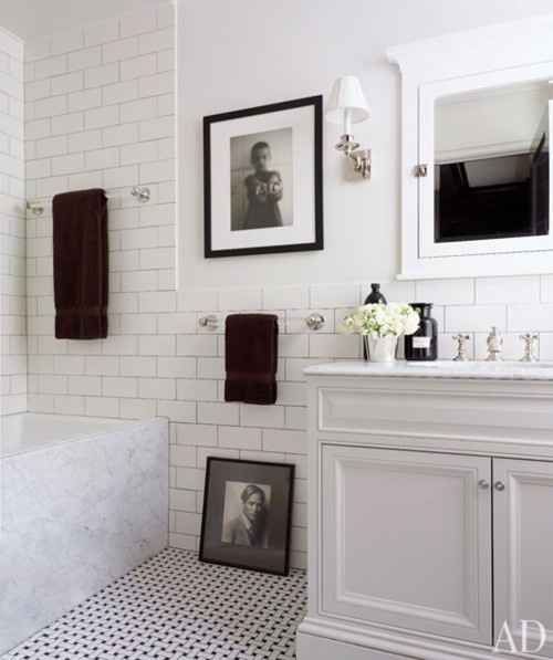 Gray And White Bathroom With Toilet Shower And Modern Brick