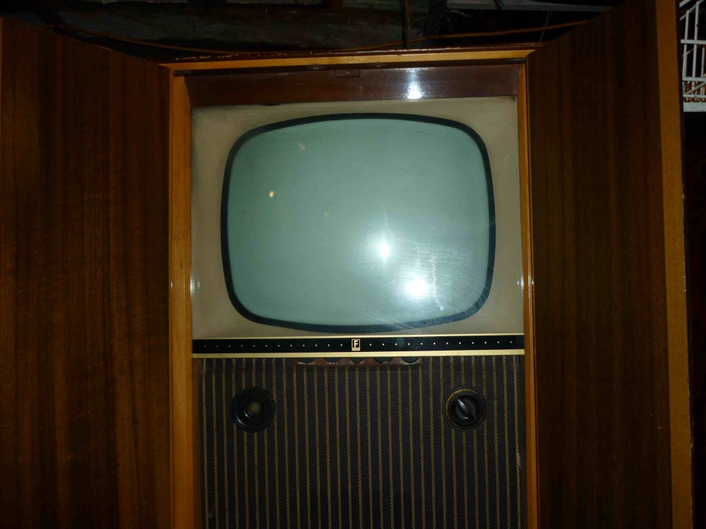 vintage tv in cabinet
