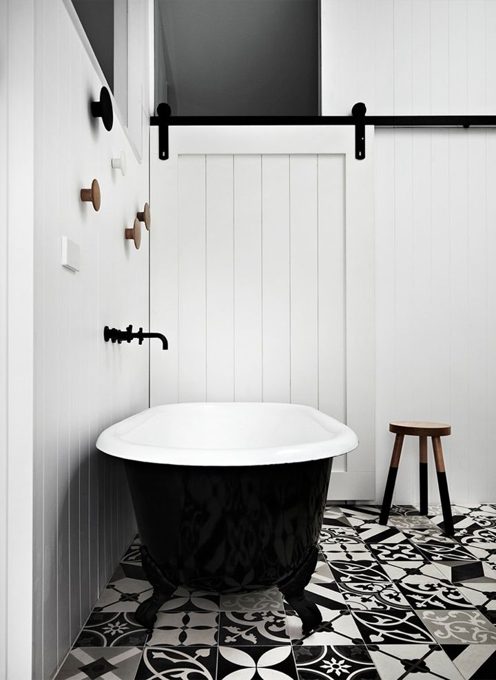 Bathroom with patterned tiles | Muuto hooks | My Friend's House